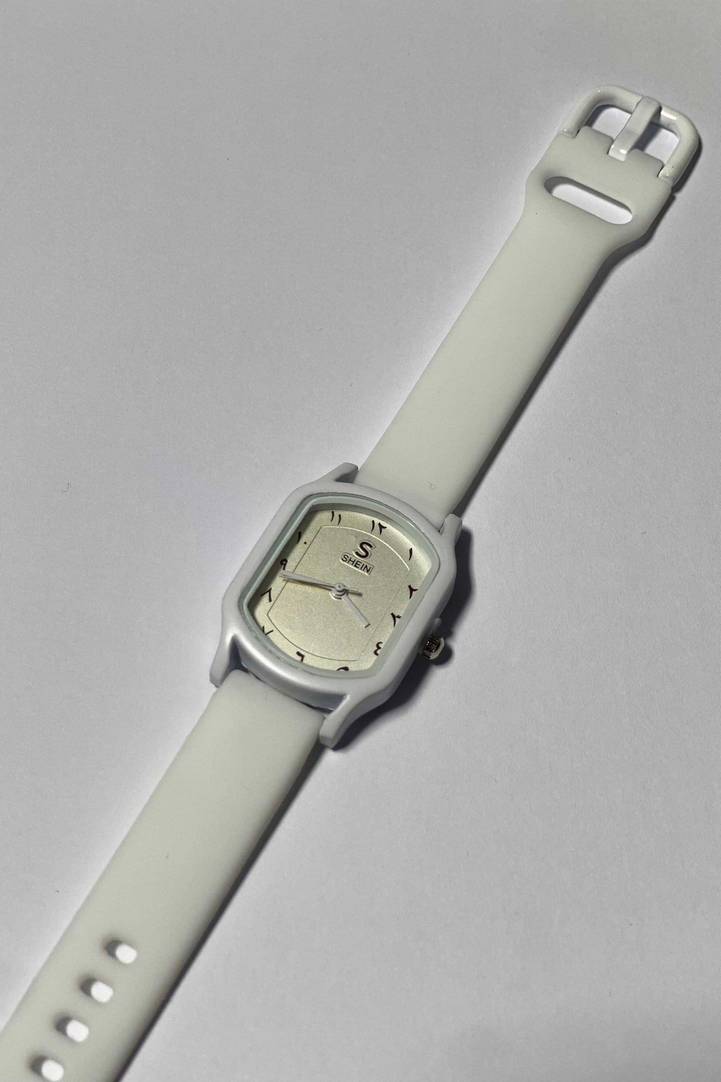 Modern White Watch with Eastern Arabic Numerals