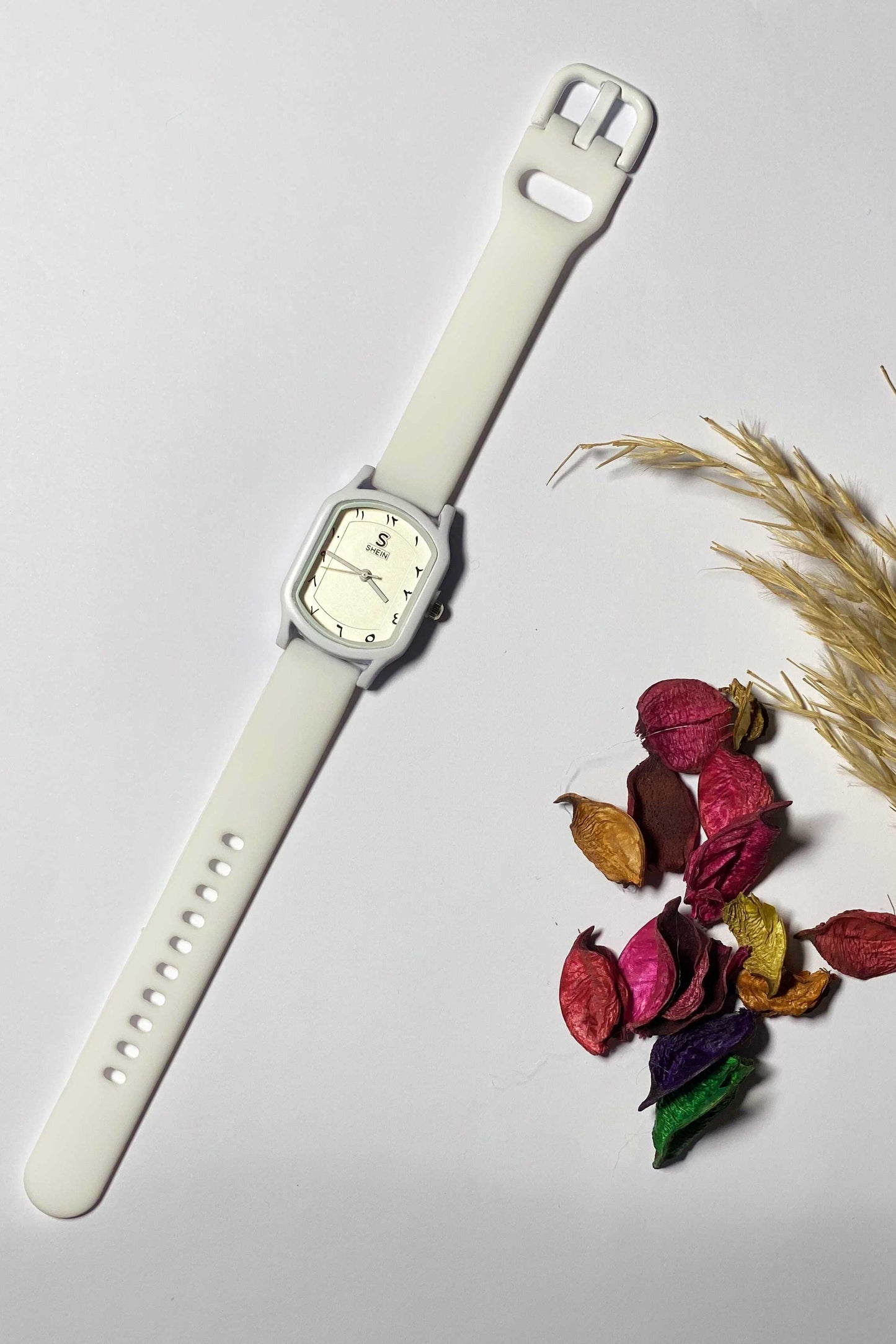 Modern White Watch with Eastern Arabic Numerals